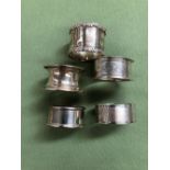 FIVE VARIOUS HALLMARKED SILVER NAPKIN RINGS. GROSS WEIGHT 91.65grms