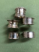 FIVE VARIOUS HALLMARKED SILVER NAPKIN RINGS. GROSS WEIGHT 91.65grms