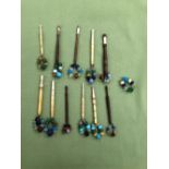 A SMALL COLLECTION OF 11 ANTIQUE BONE AND WOOD LACE MAKERS BOBBINS WITH GLASS WEIGHTS