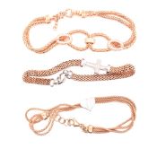 THREE SILVER AND ROSE GOLD PLATED BRACELETS. TWO WITH STONE SET ACCENTS THE OTHER WITH A HEART MOTIF