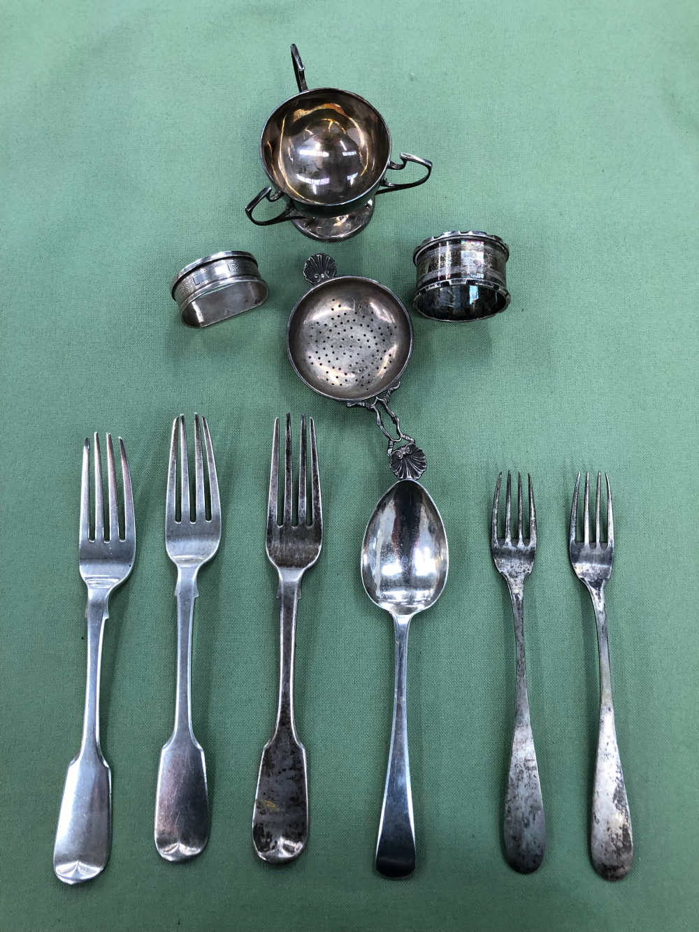 THREE HALLMARKED SILVER TABLE FORKS , LONDON 1830, A DESERT SPOON C. 1780, TWO CONTINENTAL FORKS ,