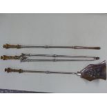 A SET OF 19TH CENTURY STEEL FIRE TOOLS WITH DECORATIVE CAST BRASS HANDLES, THE POKER 82 CM LONG