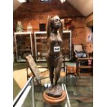 A VINTAGE AFRICAN CARVED HARDWOOD FIGURE OF A NATIVE FEMALE. HEIGHT 41cms.