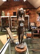 A VINTAGE AFRICAN CARVED HARDWOOD FIGURE OF A NATIVE FEMALE. HEIGHT 41cms.