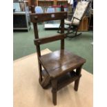 A 19th C. OAK SET OF LIBRARY STEPS, THE FOUR TREADS FOLDING UP AS A CHAIR.