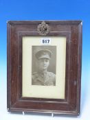 A WWI PERIOD PHOTOGRAPH OF AND RAF / RFC SERVICEMAN WITHIN A PERIOD FRAME MOUNTED HIS RFC CAP