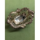 A VICTORIAN HALLMARKED SILVER PIERCED AND FLARED SMALL DISH WITH MONOGRAM INSET. DATED 1896, LONDON.