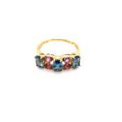 A HALLMARKED 9ct GOLD PINK AND BLUE GEM SET HALF HOOP RING. FINGER SIZE N 1/2. WEIGHT 2.24grms.