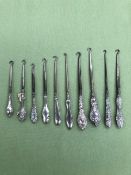 TEN ANTIQUE BUTTON HOOKS WITH SILVER HANDLES