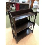 AN EARLY 20th C. EBONISED OAK SET OF THREE WALL SHELVES, THE SUPPORTING COLUMNS BOBBIN TURNED. W