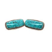 A PAIR OF SILVER AND TURQUOISE CLIP ON EARRINGS. LENGTH 3.5cms. WEIGHT 16.27grms.
