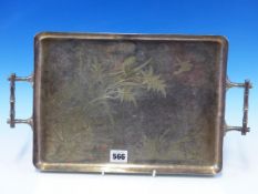 AN ANTIQUE AESTHETIC MOVEMENT ORIENTAL WATER SCENE DECORATED TWO HANDLED EPNS TRAY WITH BAMBOO STYLE