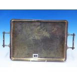 AN ANTIQUE AESTHETIC MOVEMENT ORIENTAL WATER SCENE DECORATED TWO HANDLED EPNS TRAY WITH BAMBOO STYLE