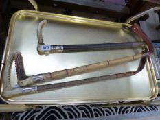 THREE ANTIQUE SILVER MOUNTED RIDING CROPS INCLUDING SWAINE.