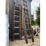 WOODEN LADDERS AND A LARGE ARTISTS EASEL