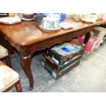 A 19th C. FRENCH MAHOGANY DINING TABLE WITH A FLORAL CARVED APRON ABOVE CABRIOLE LEGS. W 132 x D