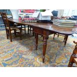 A 19th C. MAHOGANY ROUNDED RECTANGULAR DINING TABLE CONCERTINA OPENING TO TAKE TWO LEAVES. W 258 x D