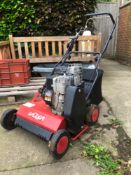 A PETROL SCARRIFIER WITH BRIGGS AND STRATTON ENGINE.