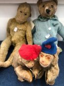 AN EARLY 20th C. TEDDY BEAR, A LATER MONKEY TOGETHER WITH TWO CLOCKWORK MONKEYS SEATED PLAYING