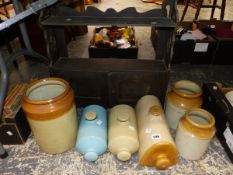 STONEWARE WARMING BOTTLES, A WALL CABINET AND THREE JARS.