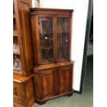 A GEORGIAN STYLE GLAZED CORNER CABINET.