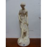 A WHITE PLASTER FIGURE OF A FEMALE BATHER