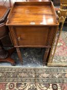 A 19th C. MAHOGANY BEDSIDE CUPBOARD WITH THREE QUARTER GALLERIED TOP AND ON CYLINDRICAL LAGS