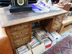 A MID 20th C. OAK PEDESTAL DESK, THE LEATHER INSET TOP ABOVE TWO BANKS OF THREE DRAWERS. W 122 x D