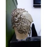 A VINTAGE 1920'S ART DECO FLAPPER METALLIC CLOCHE.