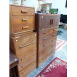 A 20th C. OAK BEDSIDE CHEST OF THREE DRAWERS, AN OAK CHEST WITH A CUPBOARD OVER THREE DRAWERS AND
