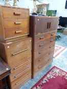 A 20th C. OAK BEDSIDE CHEST OF THREE DRAWERS, AN OAK CHEST WITH A CUPBOARD OVER THREE DRAWERS AND