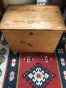 A PINE COFFER, THE HINGED LID OPENING TO REVEAL TWO PLYWOOD LIFT OUT BOXES. W 64 x D 43 x H 46cms.