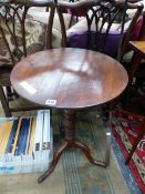 A 19th C. OAK TRIPOD TABLE, THE CIRCULAR TOP ON A TURNED COLUMN. Dia. 51 x H 70cms.