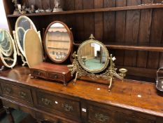 AN ANTIQUE BRASS TABLE MIRROR WITH CANDLE SCONCES, TOGETHER WITH A GEORGIAN STYLE SWING MIRROR.