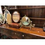 AN ANTIQUE BRASS TABLE MIRROR WITH CANDLE SCONCES, TOGETHER WITH A GEORGIAN STYLE SWING MIRROR.