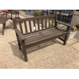 A TEAK GARDEN BENCH.