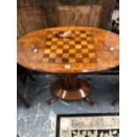 A VICTORIAN WALNUT TABLE, THE OVAL TOP INLAID WITH A CHESS BOARD ABOVE A COLUMN MEETING A DOMED OVAL