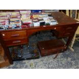 A 1940S OAK FOUR DRAWER DESK ON SQUARE LEGS. W 133 x D 72 x H 766cms.