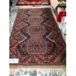 AN ANTIQUE BELOUCH RUG. 138 x 80cms