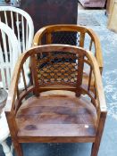 A PAIR OF INDIAN HARDWOOD AND IRON MESH HOOP BACKED ARMCHAIRS, ONE BEARING A LABEL FOR NARFAT SINGH.