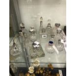 A COLLECTION OF SILVER AND ELECTROPLATE SCENT BOTTLES