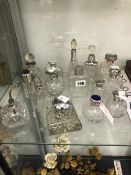 A COLLECTION OF SILVER AND ELECTROPLATE SCENT BOTTLES