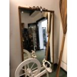 A LARGE VICTORIAN GILT FRAMED MIRROR.