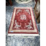 A GOOD QUALITY CHINESE DRAGON RUG. 190 x 122cms. TOGETHER WITH ANOTHER CHINESE RUG OF CIRCULAR SHAPE