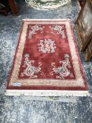 A GOOD QUALITY CHINESE DRAGON RUG. 190 x 122cms. TOGETHER WITH ANOTHER CHINESE RUG OF CIRCULAR SHAPE