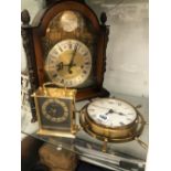 A 20th C. MANTLE CLOCK, A SEIKO CLOCK AND A SHIPS WHEEL CASED WALL CLOCK