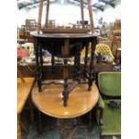 TWO OAK OVAL DROP FLAP TABLES, ANOTHER TABLE WITH THE SQUARE TOP EDGE WITH A CARVED BAND AND A