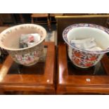 TWO CHINESE PORCELAIN PLANTERS, ONE DECORATED IN THE CANTON TASTE AND THE OTHER IN IMARI COLOURS.