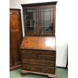 AN 18th C. WALNUT BUREAU BOOKCASE. 201 X 96 X 58cms.