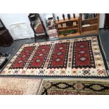 AN UNUSUAL LARGE TRIBAL KELIM CARPET. 452 x 252cms